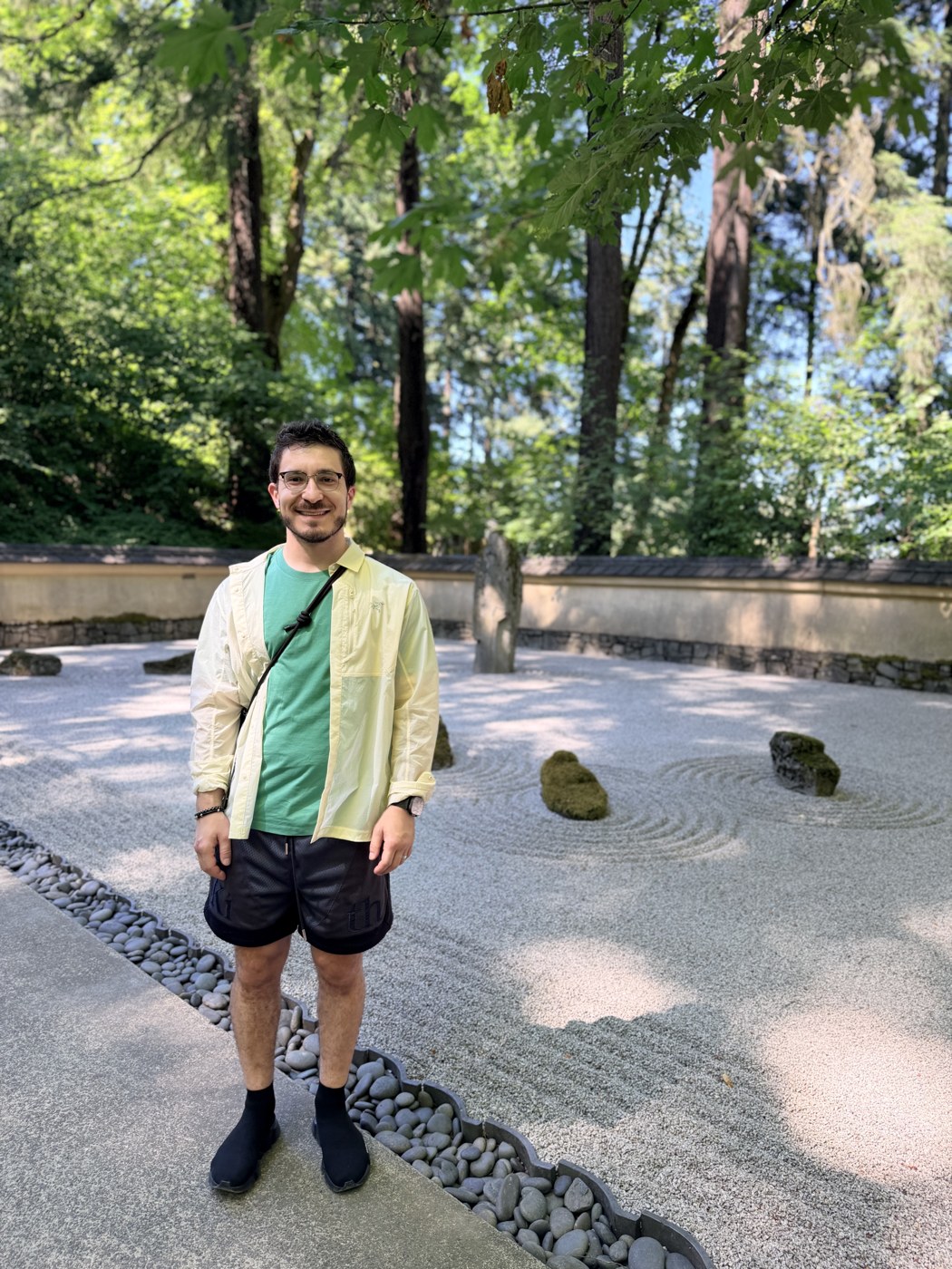 Ross standing in a peaceful garden